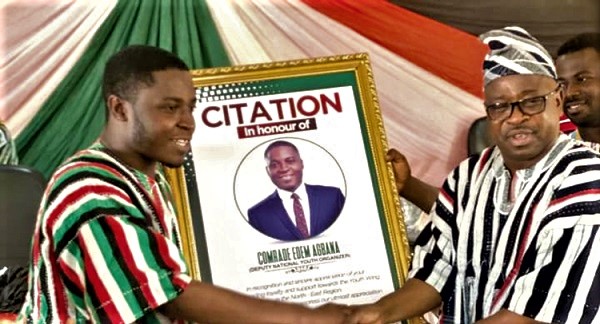  Alhaji Baba Issifu (right), MP for Nalerigu/Gambaga, presenting a citation to Edem Agbana (left), NDC Deputy National Youth Organiser